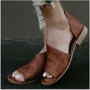 Available Cognac Deep side cut out peep toe flat